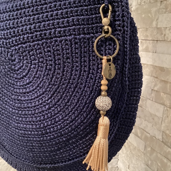 The Sak Ryder crochet crescent crossbody bag in navy blue with a tassel - Picture 2 of 14